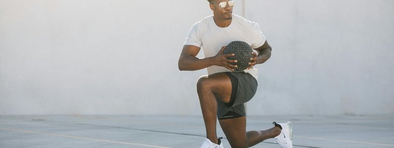 Action shot of a person performing a dynamic lunging exercise