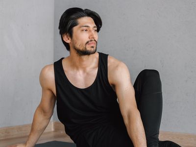 Silhouette of a man meditating after a workout session